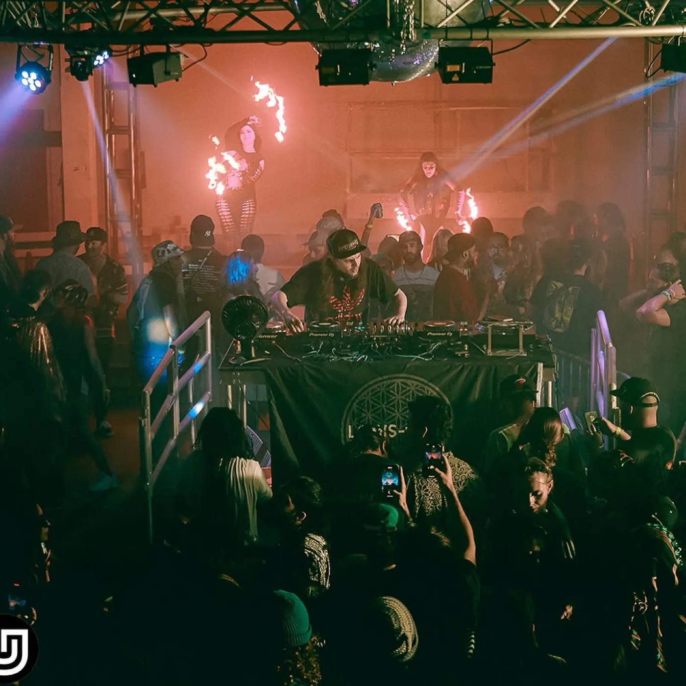 Underground Garden warehouse night event — DJ set with fire performers on stage